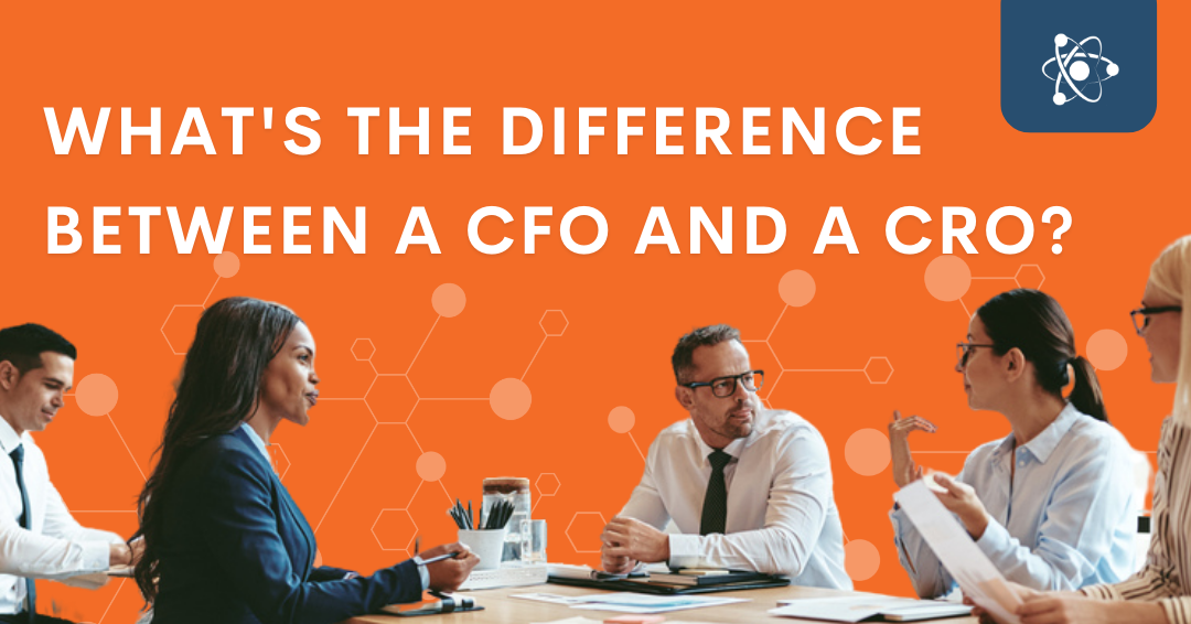 What's the difference between a CFO and a CRO title over image of executive team meeting